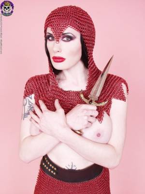 Busty chick Morrigan Hel licks a dagger while wearing chain mail and OTK boots Porn Pics english 05