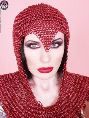 Busty chick Morrigan Hel licks a dagger while wearing chain mail and OTK boots Porn Pics english 07