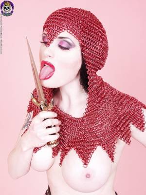 Busty chick Morrigan Hel licks a dagger while wearing chain mail and OTK boots Porn Pics english 14