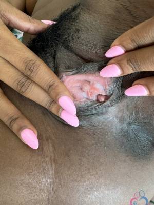 Ebony chick with big boobs and a bushy pussy shows her pink toenails on a couch Porn Pics english 10