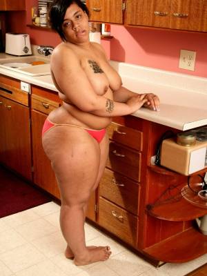 Hairy ebony Nykole shows off her big tits & her great ass in the kitchen Porn Pics english 14