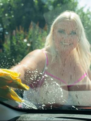 Middle-aged blonde woman displays her massive ass after washing her car Porn Pics english 11