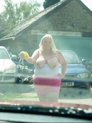 Middle-aged blonde woman displays her massive ass after washing her car Porn Pics english 12