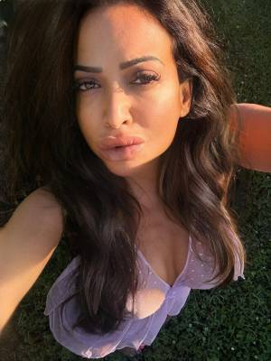 Busty amateur exposes her natural tits while posing outdoors Porn Pics english 06