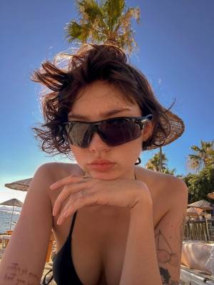 Teen amateur with short hair sports a swimsuit while crossdressing at a resort Porn Pics english 02