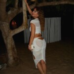Luciana Gimenez showing her breasts naked in transparent clothing