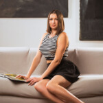 Lucy Dumas Spreading Her Legs on the Couch